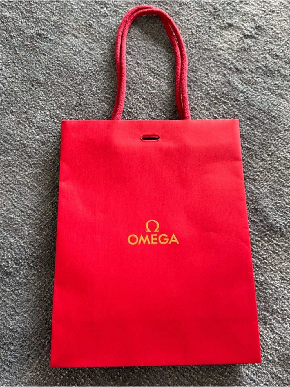 Omega Red Gift Bag with Gold Logo